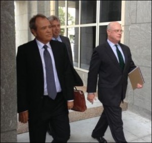Jonnie Williams (left), the prosecution's star witness, makes his appearance at the  federal courthouse.