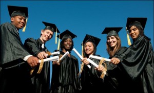 A multi ethnic group of graduates in graduation gowns