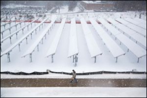 Snow-covered solar panels in Michigan.