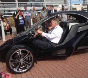 Governor McAuliffe checks out a made-in-Virginia three-wheeler outside the Virginia Beach Conference Center.
