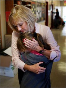 Highland View Principal Pam Smith dispenses a hug.
