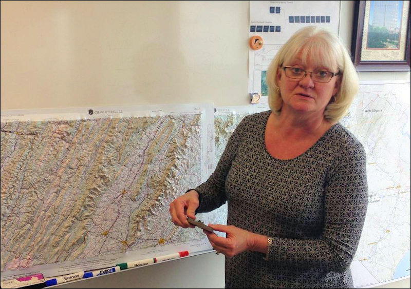 Leslie Hartz, the Dominion executive in charge of pipeline construction shows the width of steel to be used in smaller-diameter sections of pipe.