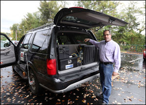 Don Perrone epitomizes the transportation revolution. Project manager at Crozet-based Perrone Robotics, he displays the innards of his self-driving car.