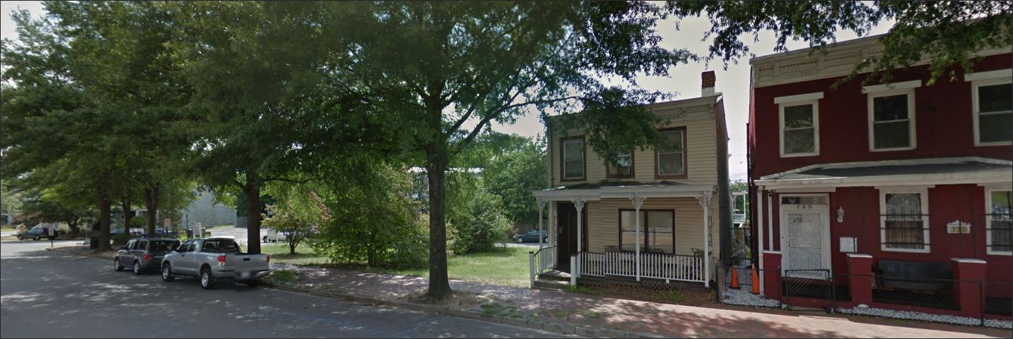 Empty lot in Union Hill where a mixed-use, three-story building is now arising.