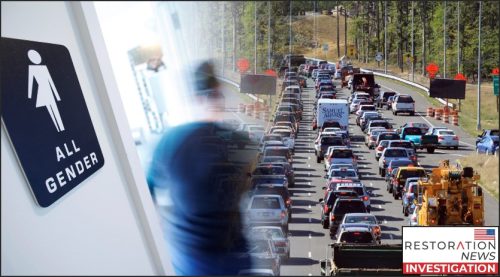 A sign for an all-gender restroom on the left and a congested highway filled with traffic on the right.