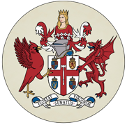 Coat of arms featuring a crowned figure, a red bird, and a red dragon, with shields and a banner below.