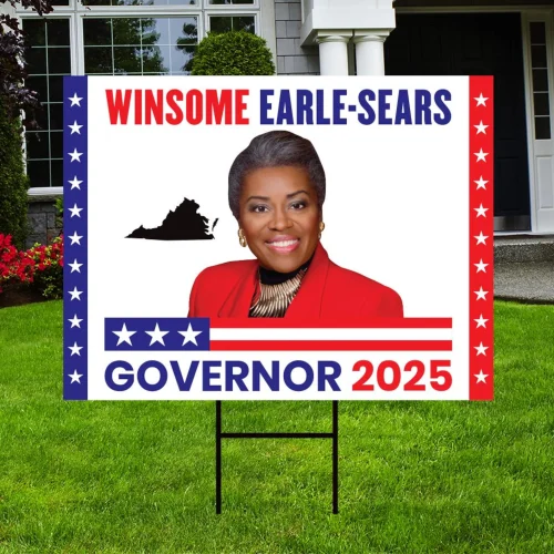 A campaign sign for Winsome Earle-Sears for Governor 2025, featuring her image and the outline of Virginia, set in a landscaped yard.