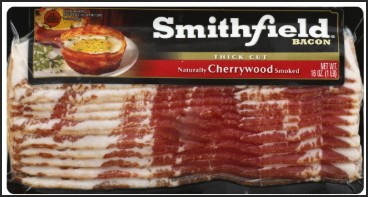 Smithfield thick cut bacon packaging, featuring cherrywood smoked bacon with a bowl of food in the background.
