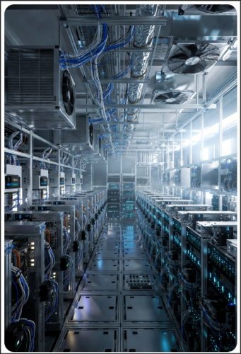 Inside a modern data center featuring rows of servers, cooling systems, and illuminated cables.