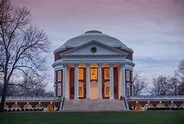 Exterior view of the Rotunda at the University of Virginia, showcasing its iconic architecture at dusk.