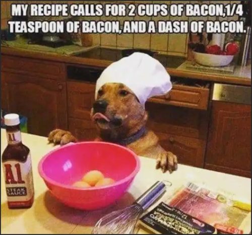 A dog wearing a chef's hat is sitting at a kitchen counter, with a bowl of eggs and ingredients around it, holding a whisk, and a humorous recipe for bacon.