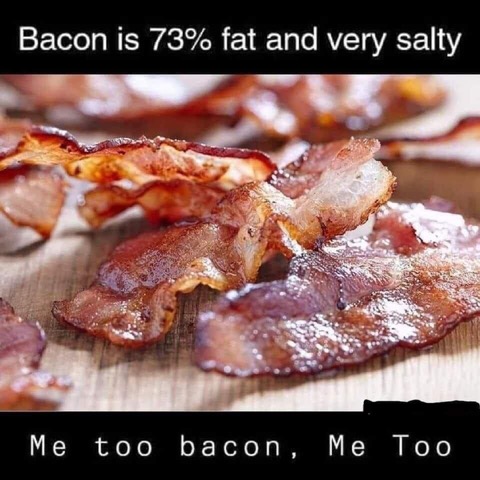 Close-up of cooked bacon strips on a wooden surface with a humorous text overlay about bacon being 73% fat and salty.