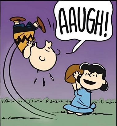 A cartoon scene depicting a character, Charlie Brown, being thrown upside down by Lucy while expressing surprise with the word 'AAUGH!' in a speech bubble.