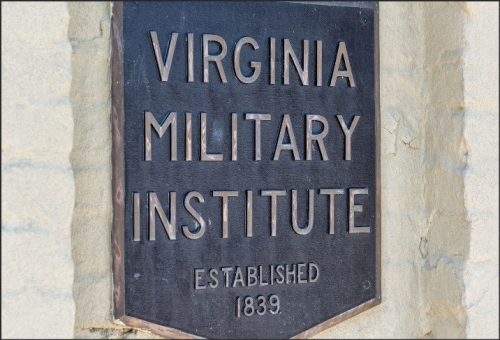 Plaque displaying 'Virginia Military Institute Established 1839' mounted on a wall.