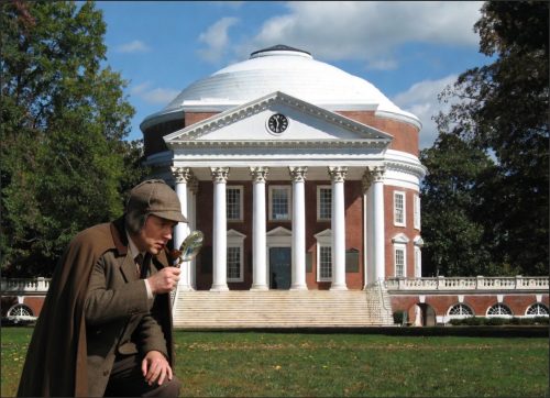 A person in a detective costume examining something with a magnifying glass in front of a large, classical building with a dome and columns.