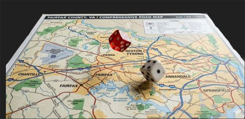A comprehensive road map of Fairfax County, Virginia, with a red die and a white die placed on top.