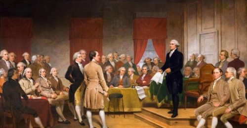 A historical painting depicting the signing of the United States Constitution, featuring George Washington and several founding fathers in a room filled with delegates.